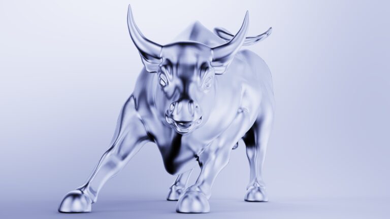 Metallic silver bull sculpture