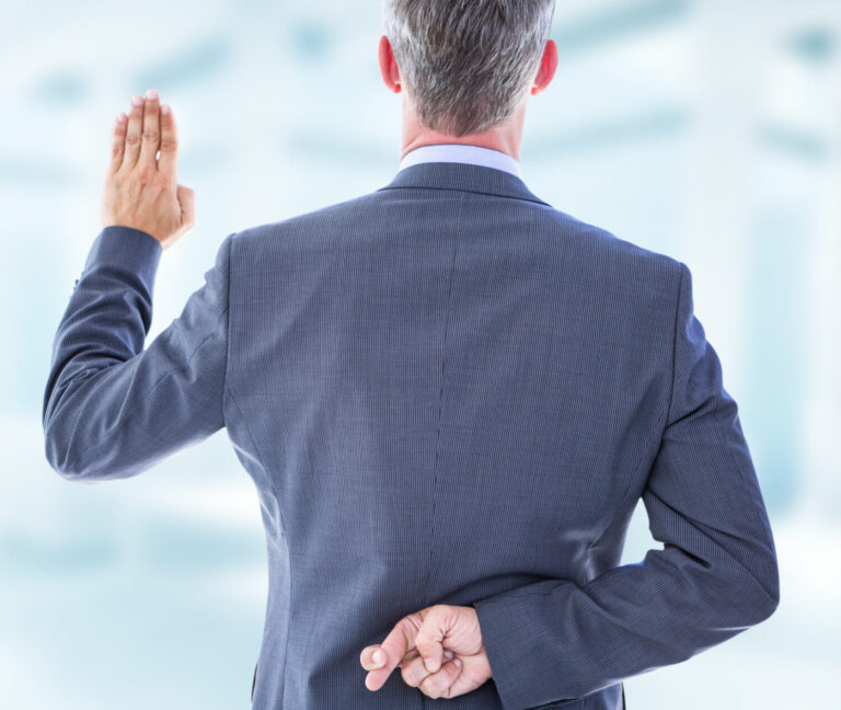 Rear view of businessman taking oath with fingers crossed against modern room overlooking city